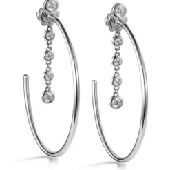 Aros "Shiny Drops" grandes de oro blanco con cadena de diamantes en chatón