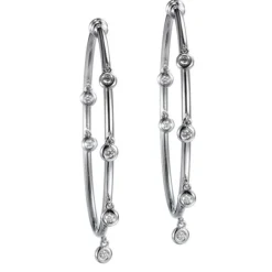 Aros "Shiny Drops" grandes de oro blanco con diamantes en chatón al aire