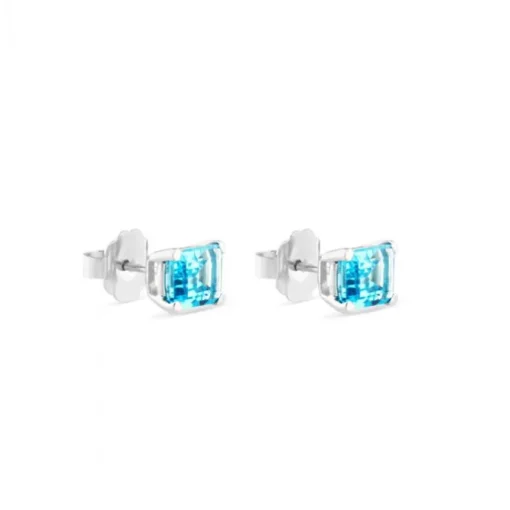 Pendientes de oro blanco con topacio azul en 4 garras talla esmeralda