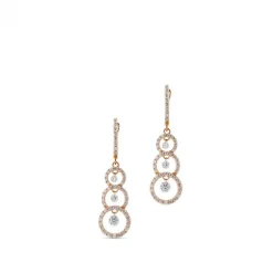 Pendientes largos de oro rosa con círculos de diamantes y diamantes al aire