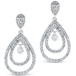 Pendientes largos de oro blanco con lagrimas de diamantes y diamante al aire