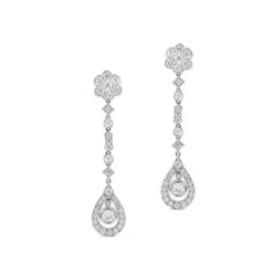Pendientes largos de oro blanco con diamantes, flor y lágrima de diamantes