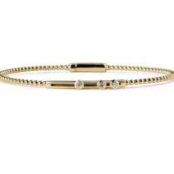 Pulsera "Bubbles" de oro amarillo con 3 diamantes móviles en chatón