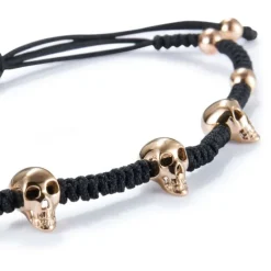 Pulsera de cordón con calaveras de oro rosa