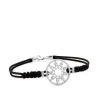 Pulsera de oro blanco y cordón negro con estrella en aro de pavé de diamantes