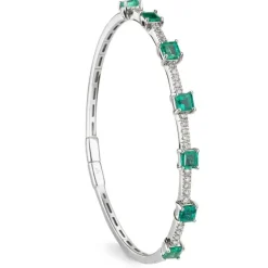 Pulsera rígida de oro blanco con esmeraldas y diamantes