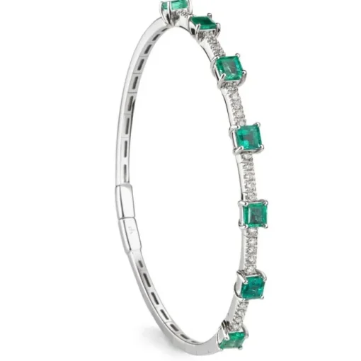 Pulsera rígida de oro blanco con esmeraldas y diamantes