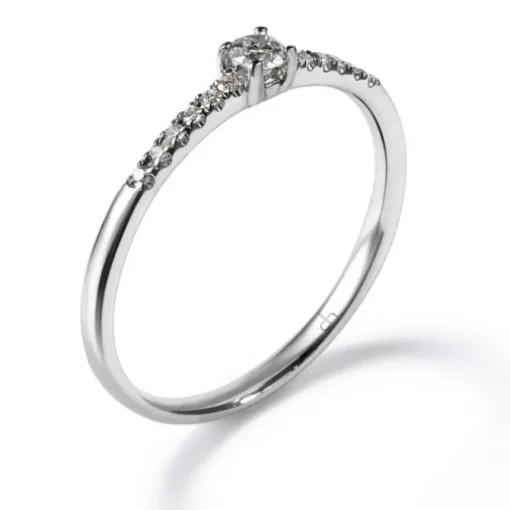 Solitario "Isabella" de oro blanco con diamante talla brillante y diamantes en garra