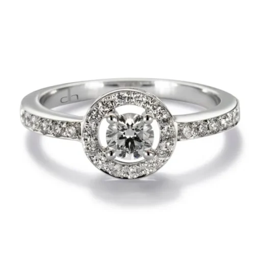 Solitario "María Valentina" de oro blanco con diamante central en 4 garras, orla y montura de diamantes