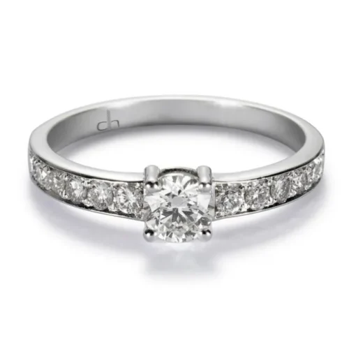 Solitario "Norah" de oro blanco con diamante central en garra y brillantes en montura