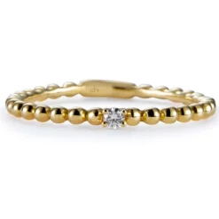 Sortija "Bubbles" de oro amarillo con diamante en 4 garras