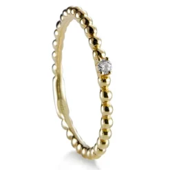 Sortija "Bubbles" de oro amarillo con diamante en 4 garras