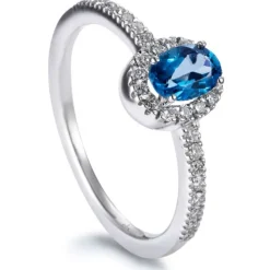 Sortija "Caramelo" de oro blanco con Topacio London talla oval y diamantes