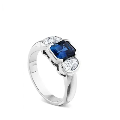 Sortija de oro blanco con diamantes y zafiro azul