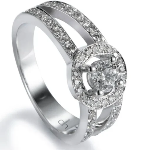 Sortija "Martina" de oro blanco con diamante central en 4 garras de 0.31 quilates, orla y montura de diamantes